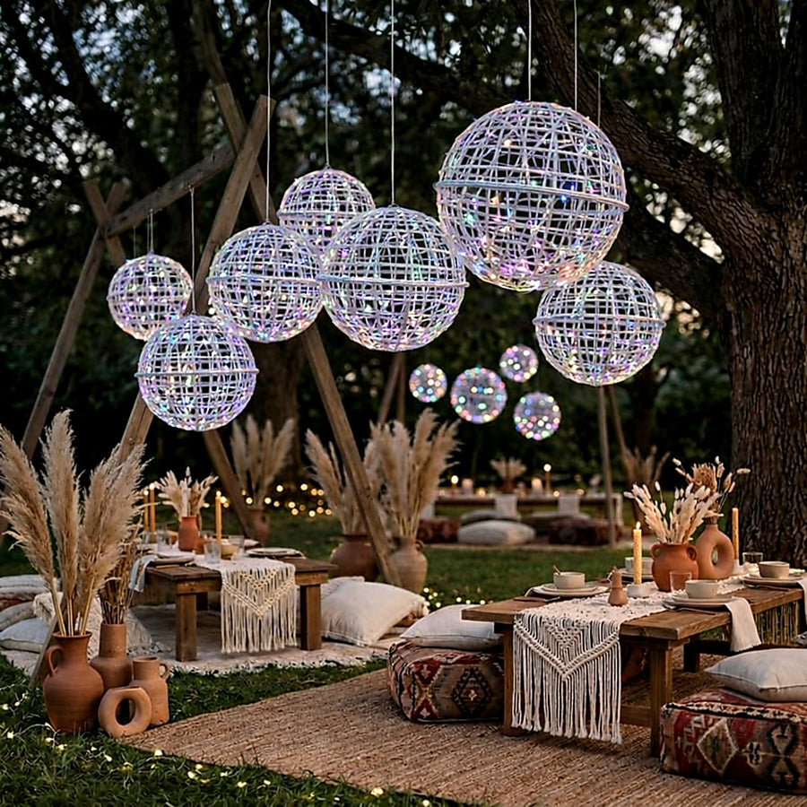 Outdoor boho-style event decor with hanging lights and rustic seating.