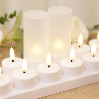 White LED candles in a decorative holder on a soft background.