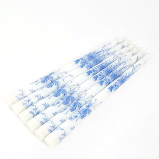 Set of six blue and white floral design candles