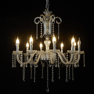 Elegant crystal chandelier with multiple lights and intricate detailing. #whtbkgd