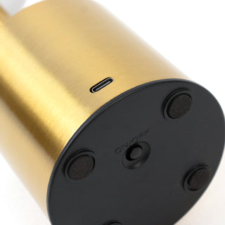 Gold and black lamp base with USB-C port and power switch.