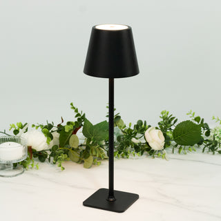 Black table lamp with a minimalist design and a round shade.