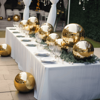 Elegant gold decorative spheres on a dining table for a festive event.