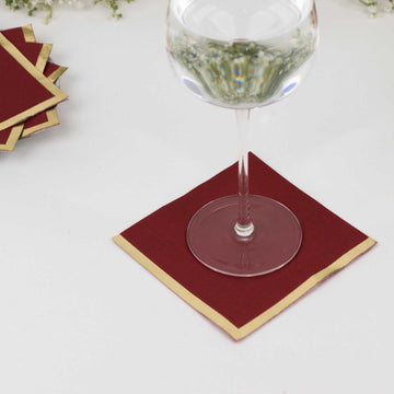 50 Pack Burgundy Disposable Cocktail Napkins with Gold Foil Edge, Soft 2 Ply Paper Beverage Napkins - 5"x5"
