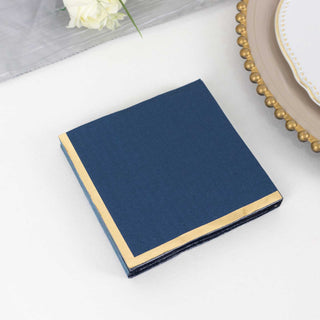 <strong>Navy Blue Paper Beverage Napkins With Gold Foil Edges</strong>