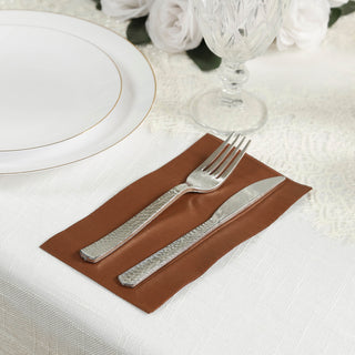 Elegant brown cutlery holder with fork and knife on a dining table setting.