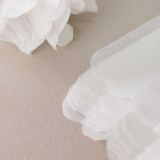 Create a Whimsical Atmosphere with White Tissue Paper Pom Poms