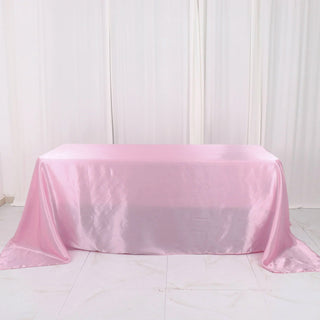 Add Elegance to Your Event with the 90"x132" Pink Satin Seamless Rectangular Tablecloth