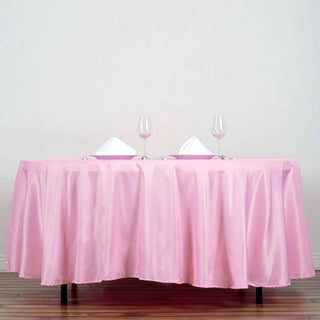 Add Elegance to Your Event with the 108" Pink Polyester Round Tablecloth Add Elegance to Your Event with the 108" Pink Polyester Round Tablecloth