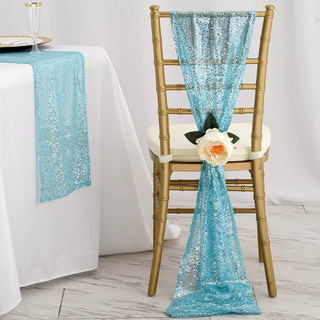 Turquoise sequin chair sash with flower accent on a gold chair