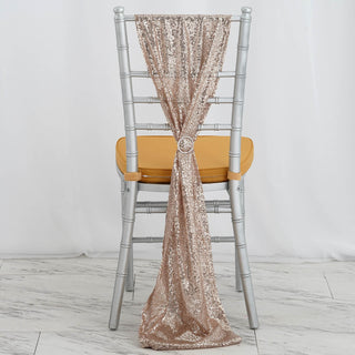 Rose gold sequin chair sash draped on a silver chiavari chair.