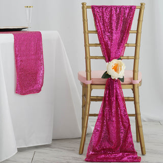 Pink sequin chair sash with flower decor on a gold chiavari chair.
