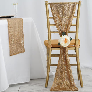 Gold sequin chair sash with flower decoration on a gold chiavari chair.