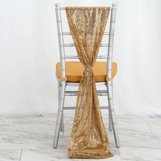 Gold sequin chair sash tied on a silver chiavari chair.