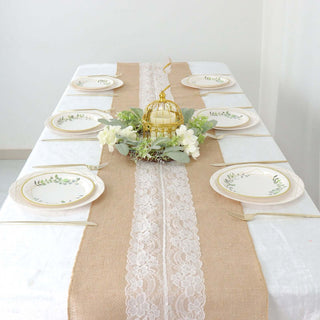 Elegant table setting with decorative plates and floral centerpiece.