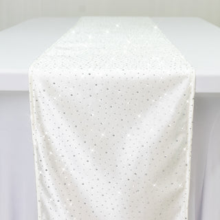 White table runner with sparkling rhinestones on a plain background.