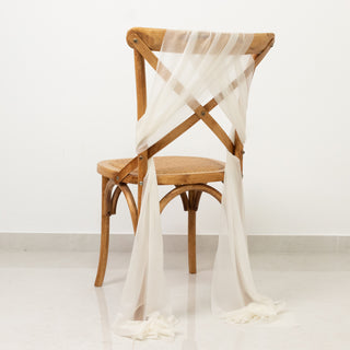 Elegant wooden chair draped with sheer fabric