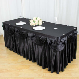 Create a Luxurious Atmosphere with the Black Pleated Satin Double Drape Table Skirt Create a Luxurious Atmosphere with the Black Pleated Satin Double Drape Table Skirt