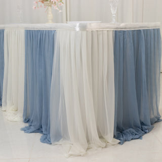 Elegant blue and white table skirt draped elegantly around a table.