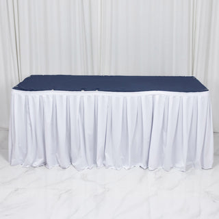 White fitted tablecloth with navy table cover for event display table