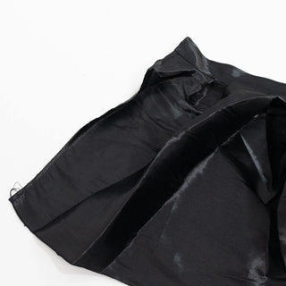 Black satin fabric draped on a white background#whtbkgd