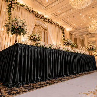 Elegant wedding reception table with floral arrangements in a luxury ballroom