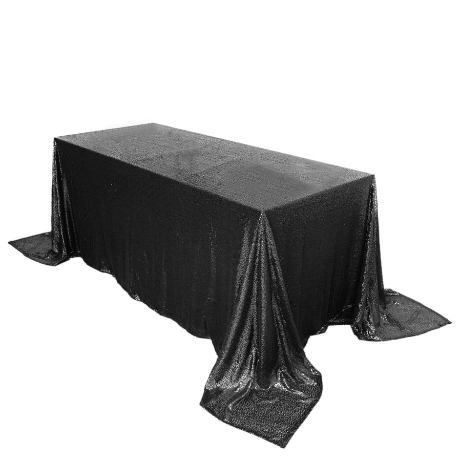 Black sequin tablecloth draped over a rectangular table