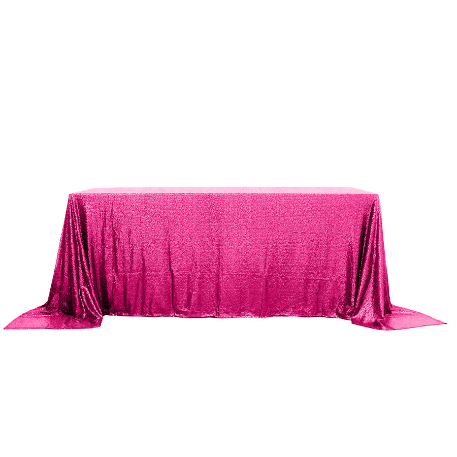 Shimmering pink tablecloth draped elegantly over a table