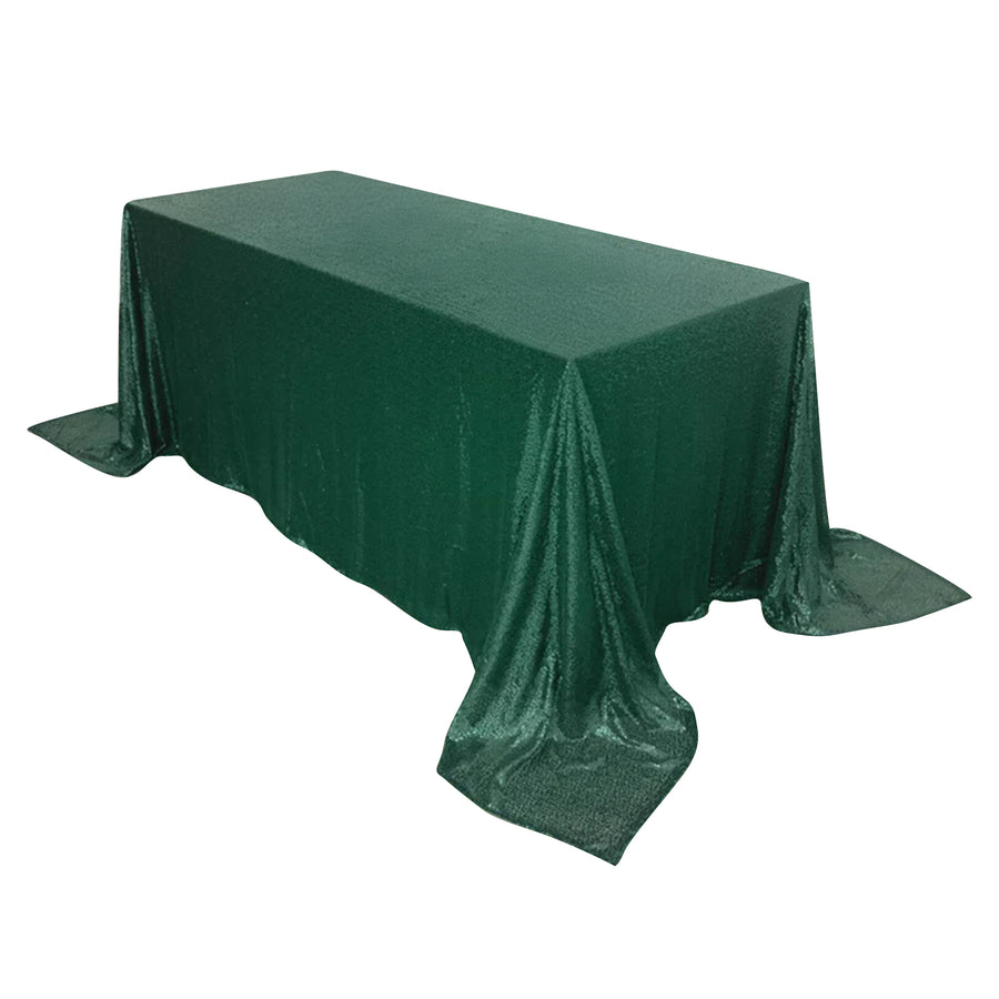 Green sequin tablecloth draping over a rectangular table