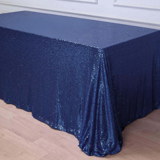 Navy blue sequin tablecloth draped elegantly on a table.
