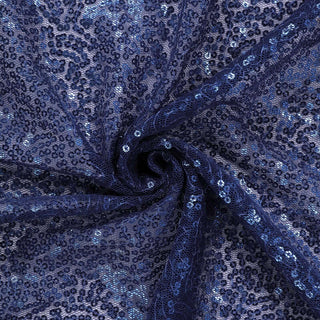 Navy sequin fabric in a spiral pattern with intricate lace details. #whtbkgd