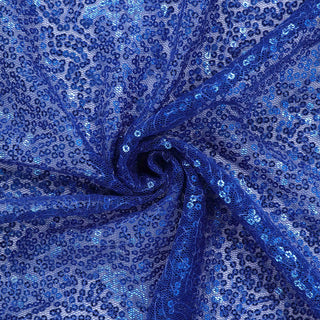 Blue sequin fabric with intricate lace patterns and sparkling embellishments. #whtbkgd