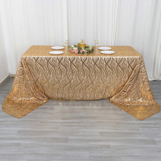 Gold sequin tablecloth on a banquet table with decorative items