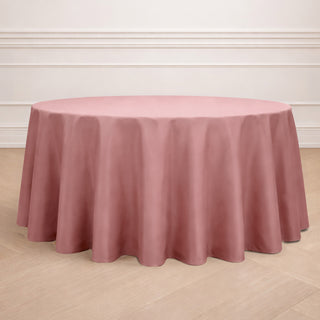 Round pink tablecloth draped elegantly over a table.