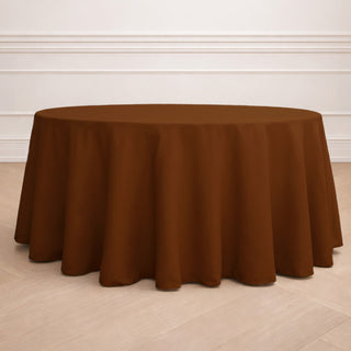Brown round tablecloth draped over a table in a stylish setting.