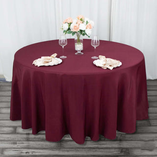 Elevate Your Event with the Burgundy Premium Polyester Round Tablecloth Elevate Your Event with the Burgundy Premium Polyester Round Tablecloth