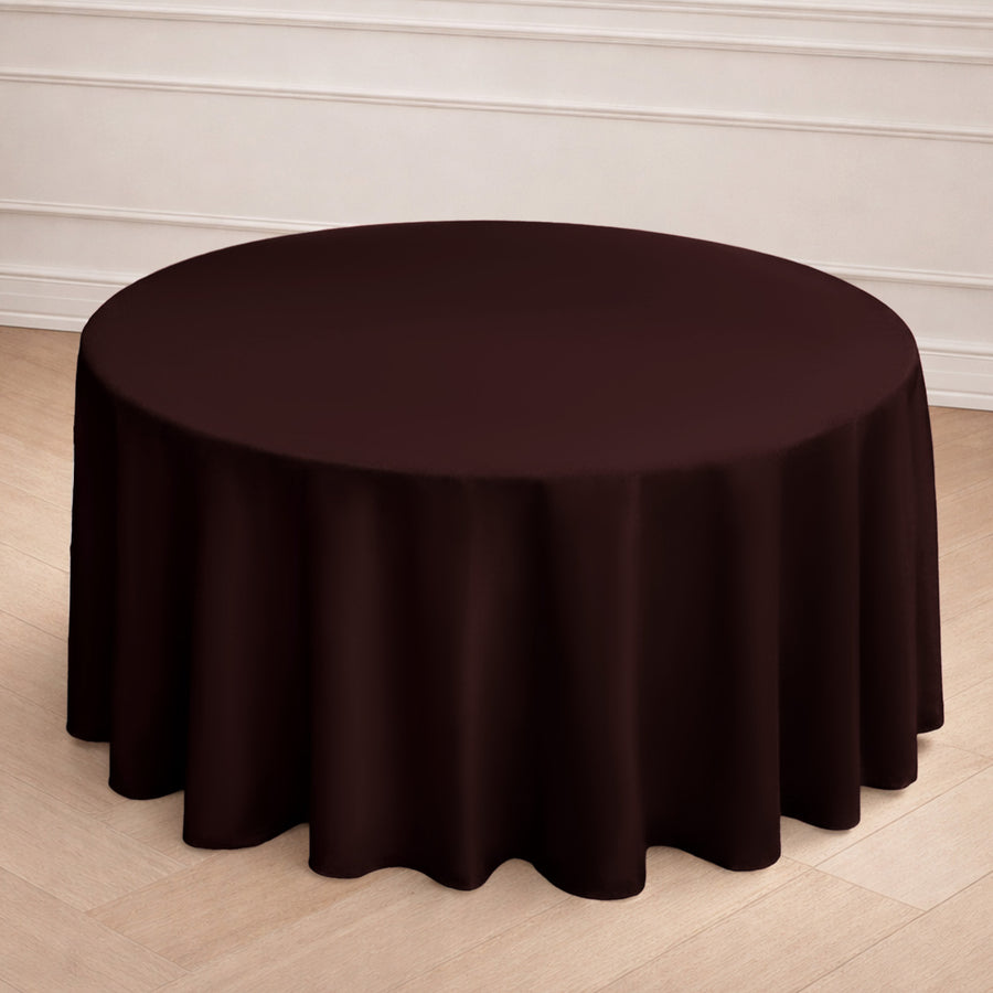 Round burgundy tablecloth draping elegantly over a table.