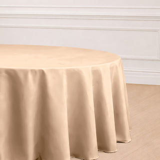 Beige round tablecloth draping elegantly over a table.