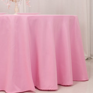 Pink tablecloth draping over a table for events or dining.