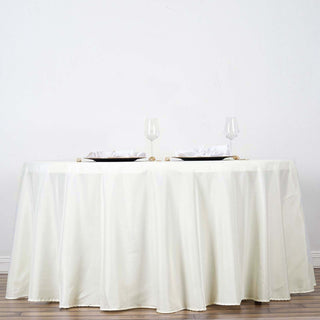 Elevate Your Event with the Ivory Seamless Polyester Round Tablecloth Elevate Your Event with the Ivory Seamless Polyester Round Tablecloth
