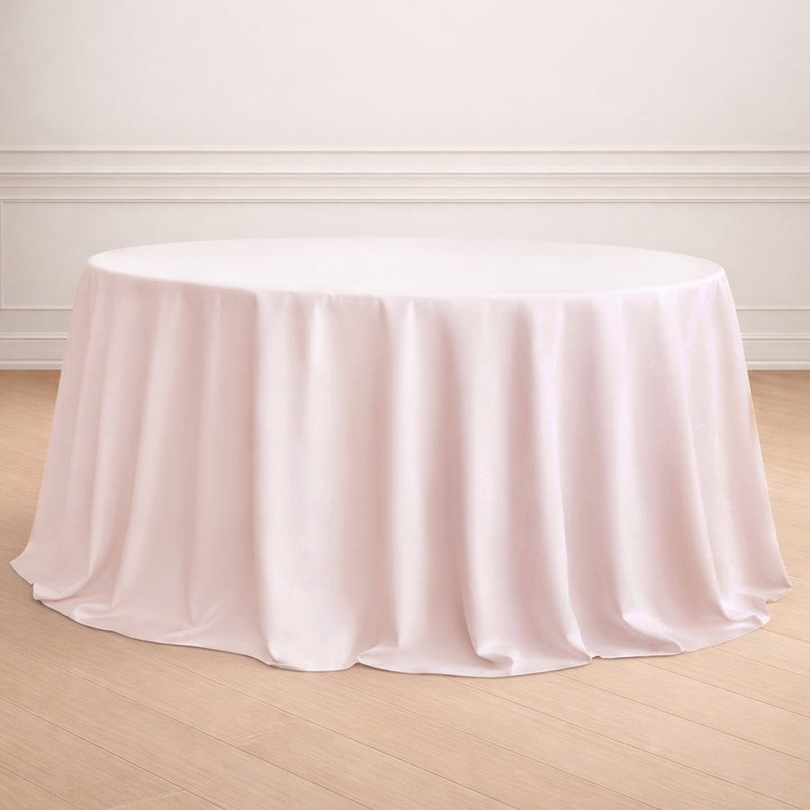 Round pink tablecloth draped elegantly over a table.