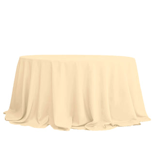 Round beige tablecloth draping elegantly over a table.