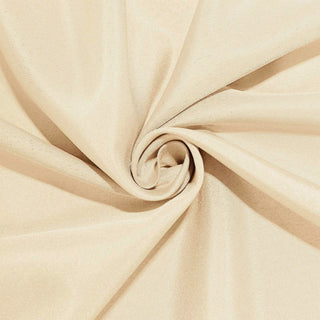 Beige fabric with a smooth texture, elegantly twisted in a spiral shape. #whtbkgd