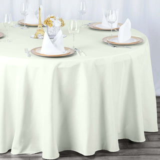 Elevate Your Event with the 132" Ivory Seamless Premium Polyester Round Tablecloth Elevate Your Event with the 132" Ivory Seamless Premium Polyester Round Tablecloth