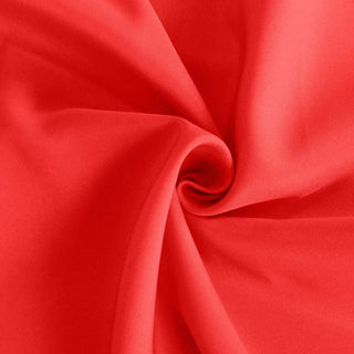 Close-up of smooth, vibrant red fabric texture.