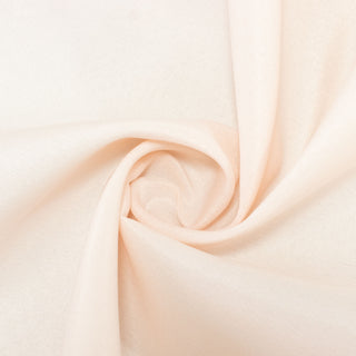 Soft peach fabric swirled to show texture and drape. #whtbkgd