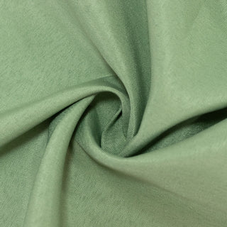 Green fabric texture in a swirled pattern. #whtbkgd