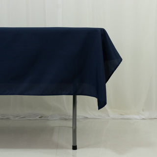 Navy tablecloth draped over a table with metal legs