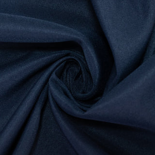 Navy blue fabric swirl texture close-up shot. #whtbkgd