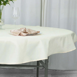 Experience Luxury with the Ivory Premium Polyester Round Tablecloth Experience Luxury with the Ivory Premium Polyester Round Tablecloth
